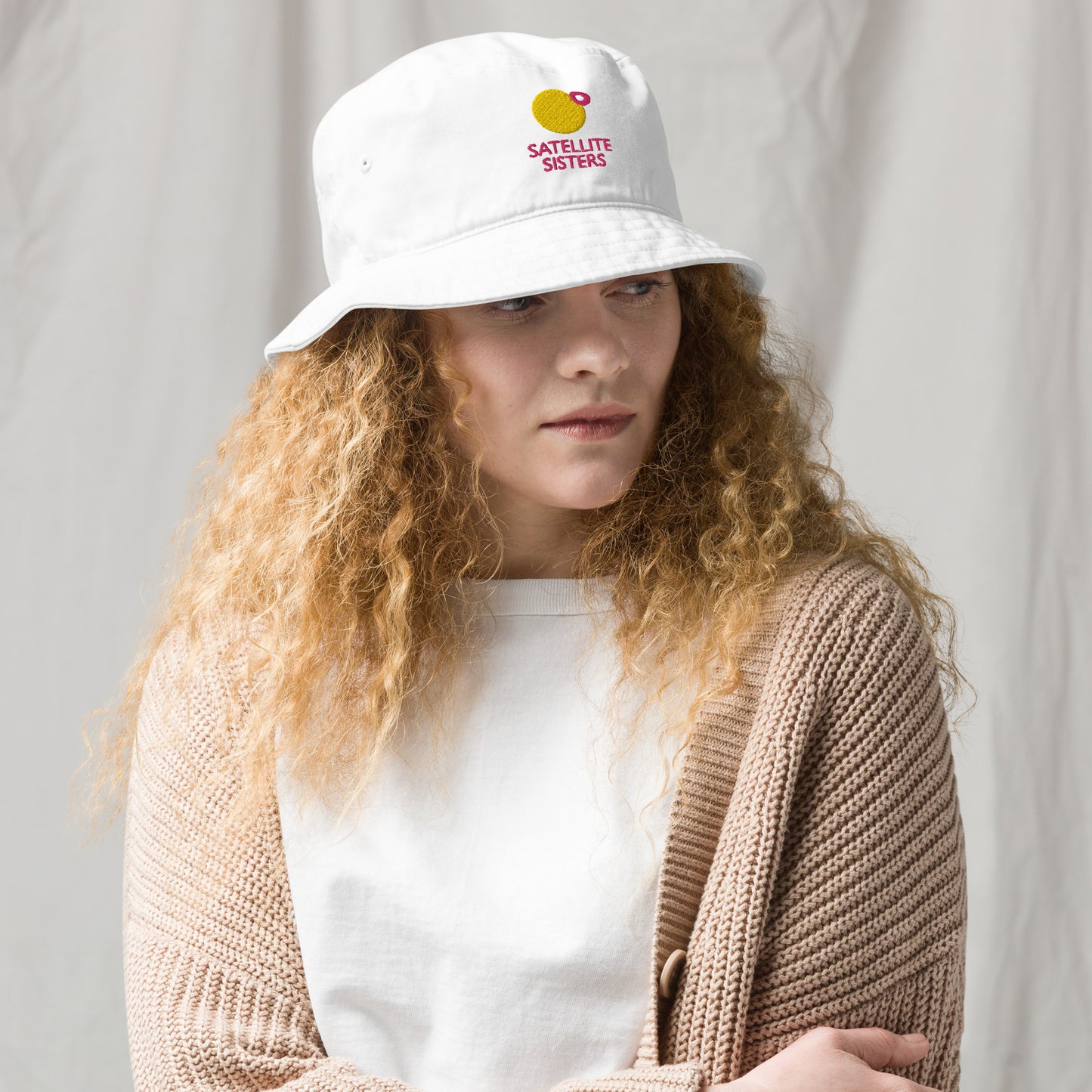 Organic bucket hat with Satellite Sisters logo